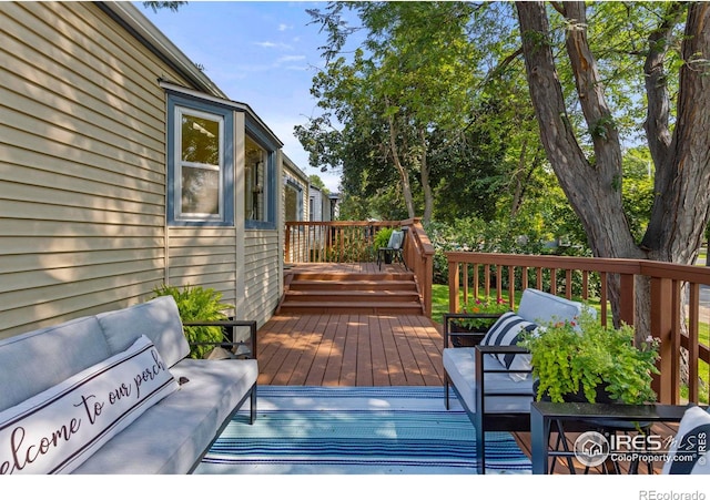 wooden deck featuring outdoor lounge area