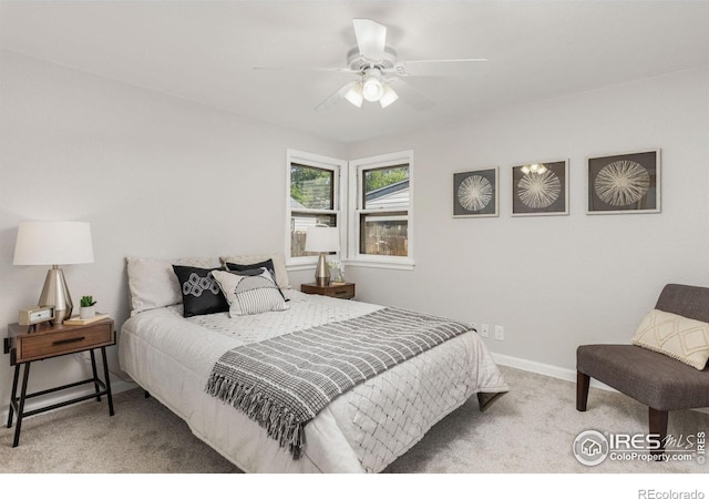 bedroom featuring a ceiling fan, carpet, and baseboards