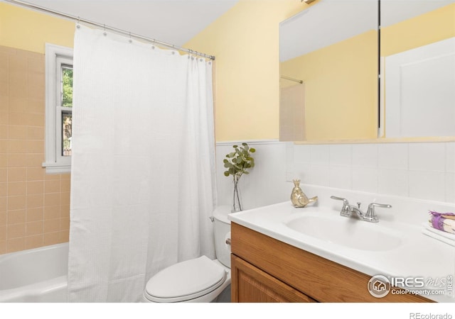 full bath featuring shower / bath combination with curtain, vanity, and toilet