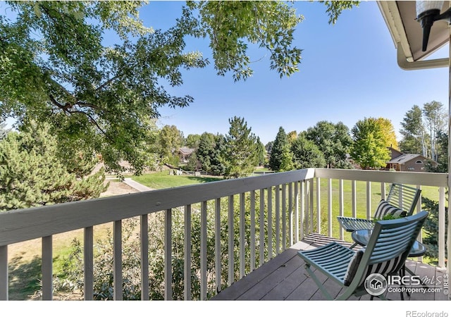 wooden terrace with a yard