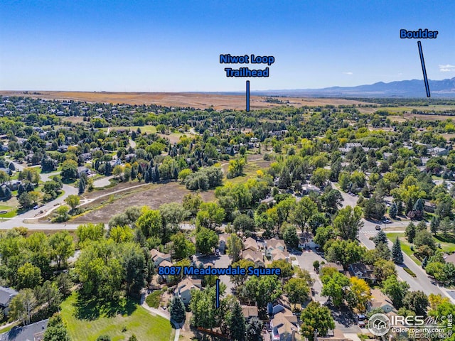 drone / aerial view featuring a residential view and a mountain view