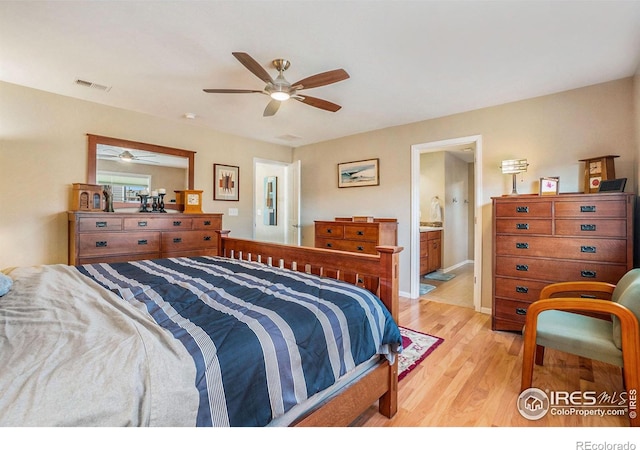 bedroom with ceiling fan, light wood-type flooring, ensuite bath, and visible vents