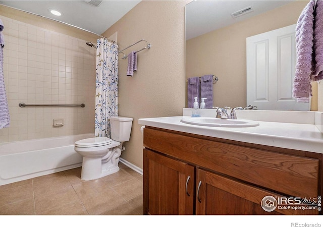 bathroom with toilet, visible vents, vanity, tile patterned floors, and shower / bath combo with shower curtain