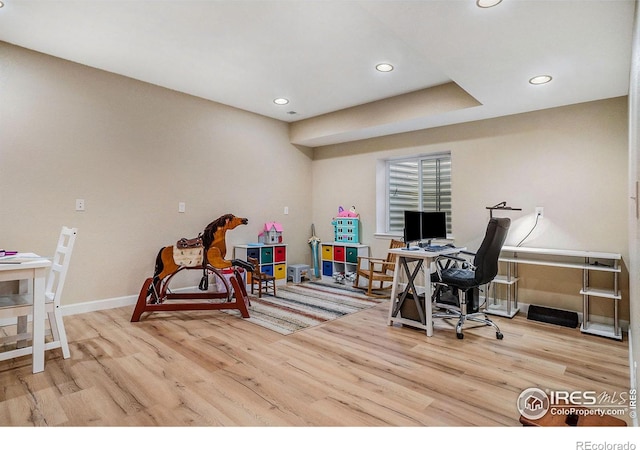 office with light wood-type flooring, baseboards, and recessed lighting