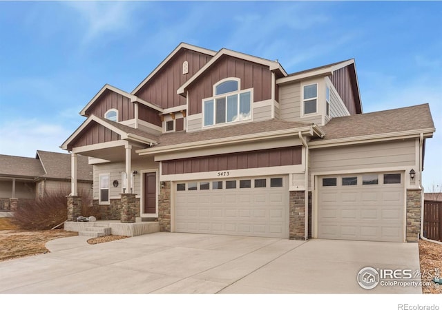 craftsman house featuring driveway, an attached garage, and board and batten siding