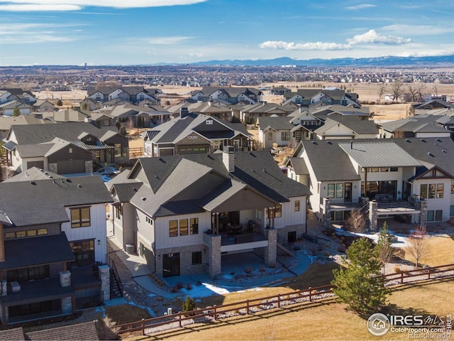 bird's eye view featuring a residential view and a mountain view