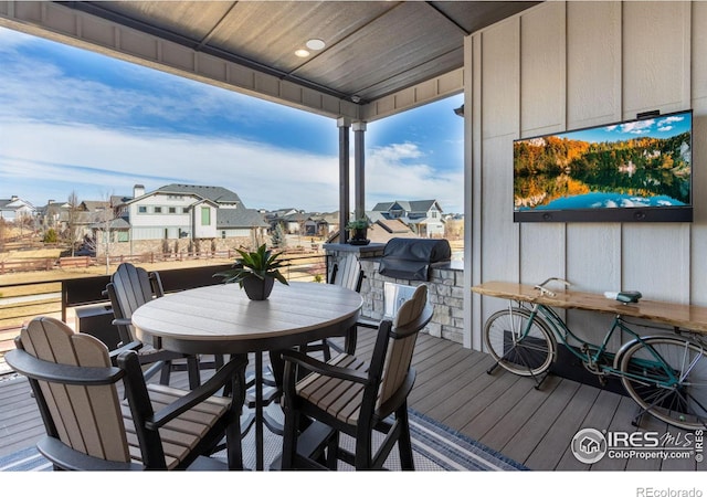 wooden terrace featuring a residential view