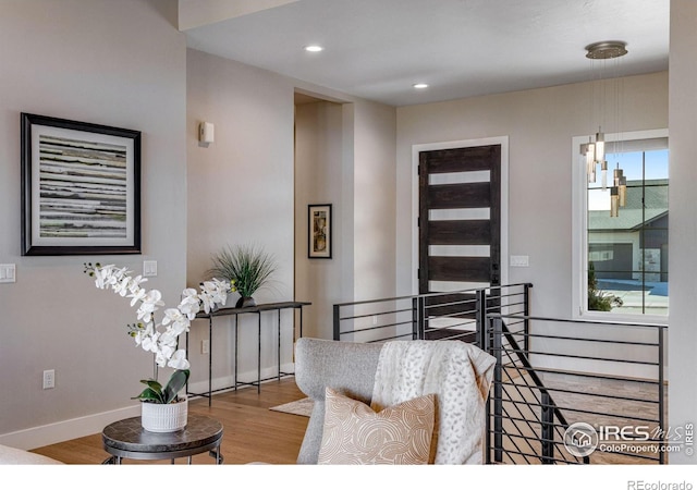 entrance foyer with recessed lighting, baseboards, and wood finished floors