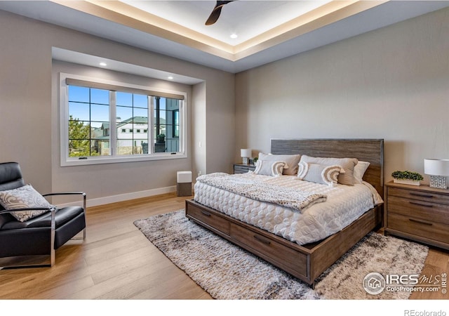 bedroom featuring baseboards, ceiling fan, recessed lighting, and light wood-style floors