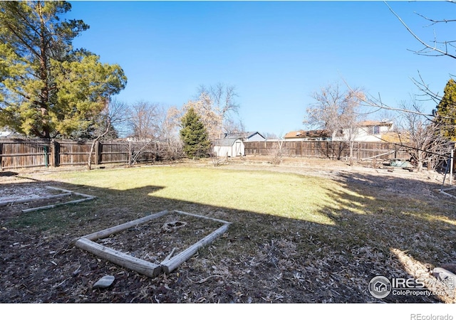 view of yard with a fenced backyard