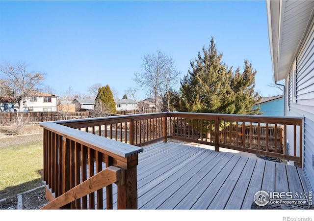 deck with a fenced backyard and a residential view