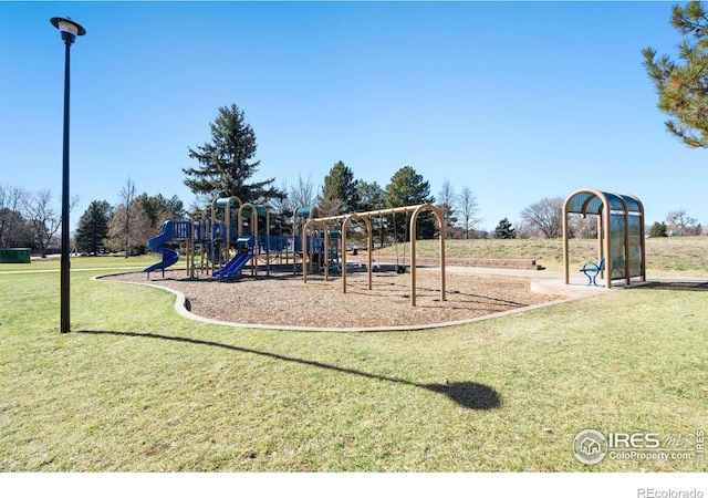 community playground featuring a lawn