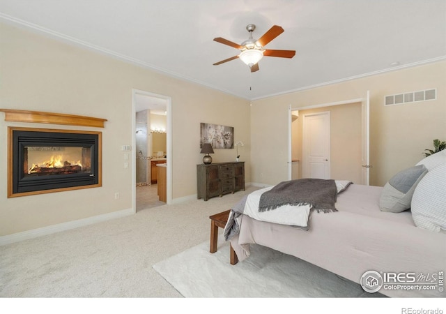 bedroom with carpet floors, visible vents, crown molding, and baseboards