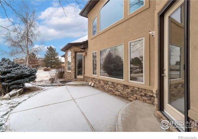 view of snow covered patio