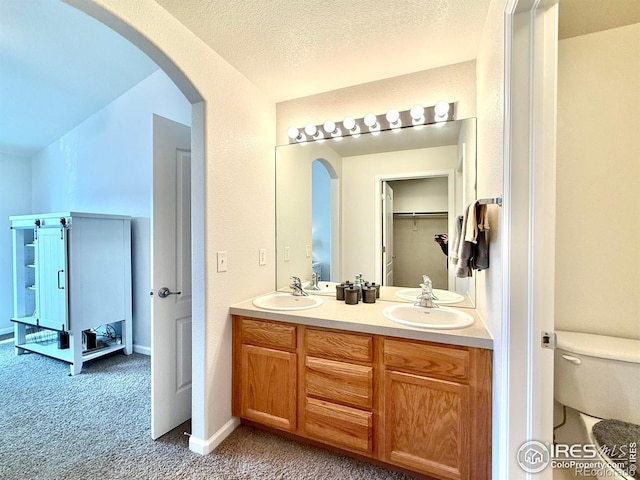 4645 Hahns Peak Dr Unit 201, Loveland, CO 80538 - full bath with double vanity, toilet, and baseboards