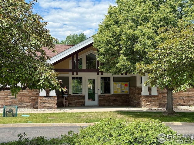 4645 Hahns Peak Dr Unit 201, Loveland, CO 80538 - view of front of home with stone siding