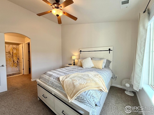4645 Hahns Peak Dr Unit 201, Loveland, CO 80538 - carpeted bedroom with arched walkways, ceiling fan, and baseboards