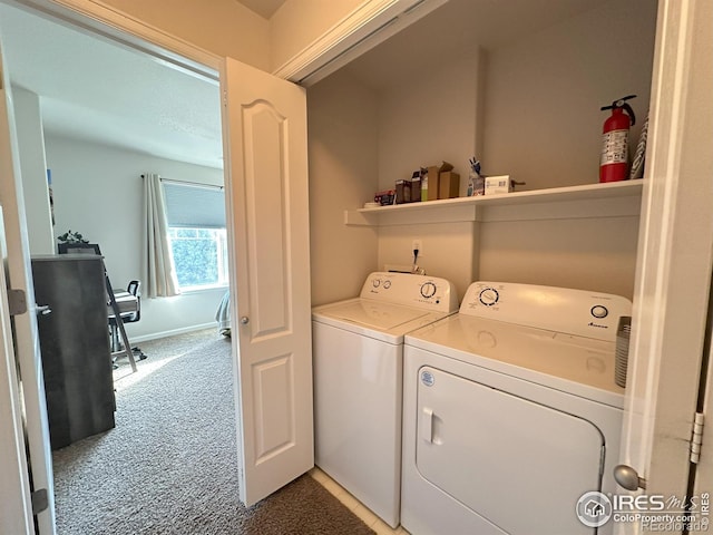 4645 Hahns Peak Dr Unit 201, Loveland, CO 80538 - laundry room featuring independent washer and dryer, light colored carpet, and baseboards