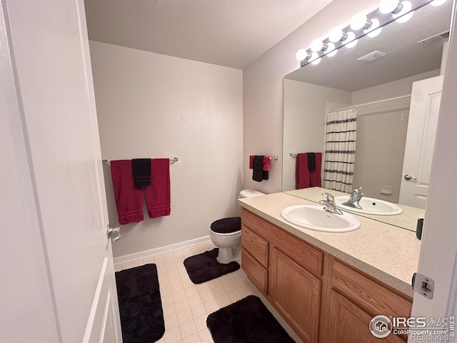 4645 Hahns Peak Dr Unit 201, Loveland, CO 80538 - bathroom with vanity, toilet, tile patterned floors, curtained shower, and baseboards