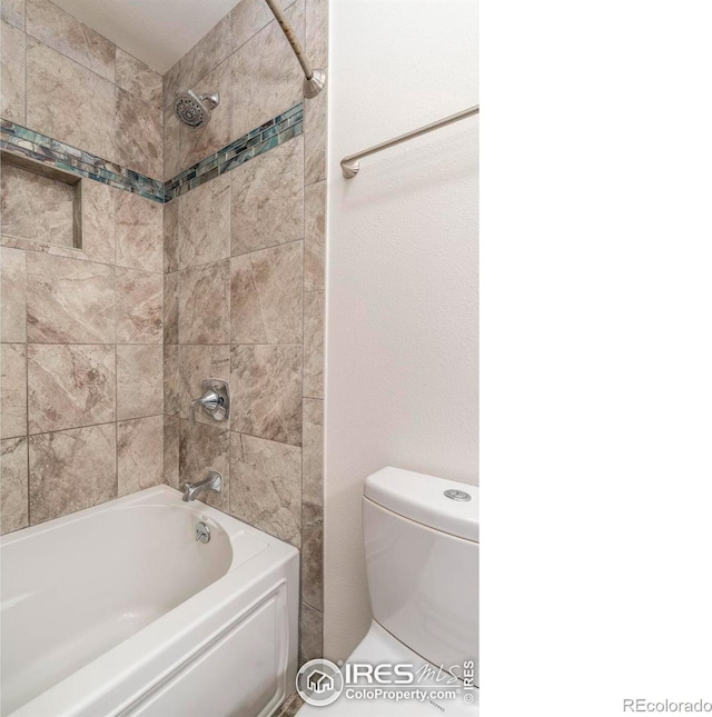 bathroom with toilet and shower / tub combination