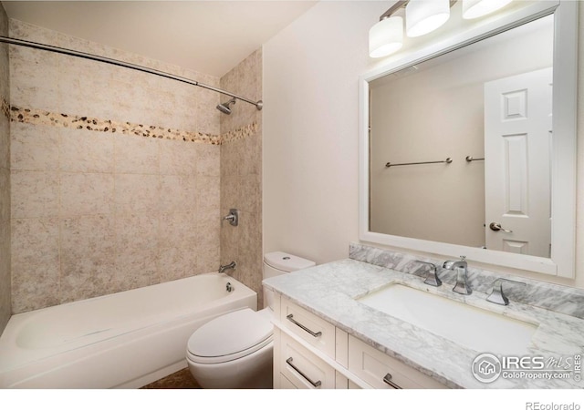 bathroom featuring toilet, washtub / shower combination, and vanity