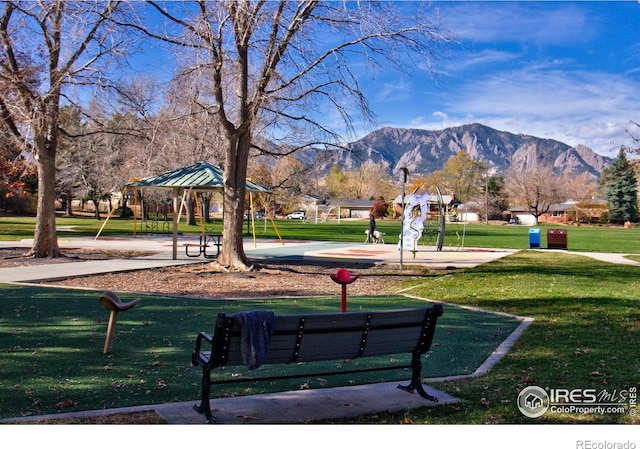 surrounding community with a gazebo, a lawn, and a mountain view