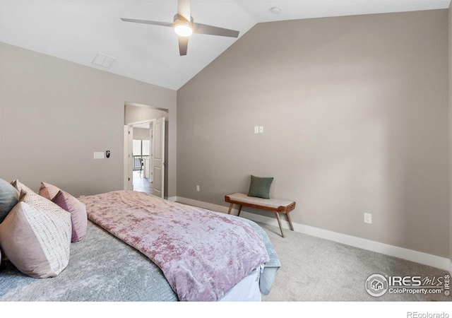 carpeted bedroom with vaulted ceiling, baseboards, and ceiling fan