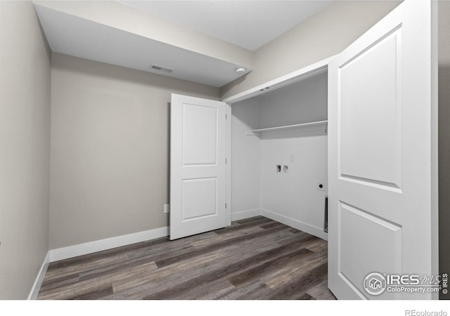 laundry area featuring visible vents, dark wood-type flooring, hookup for an electric dryer, laundry area, and baseboards