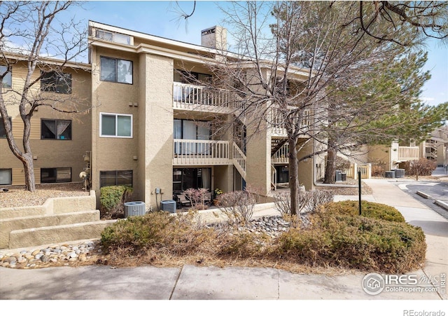 view of property featuring central AC unit