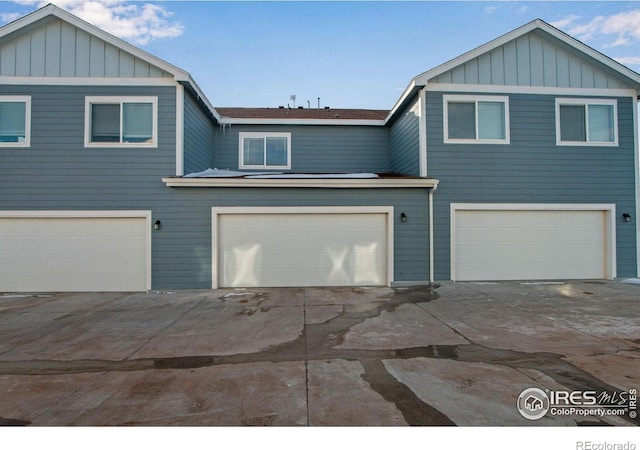 view of front of home featuring a garage and board and batten siding