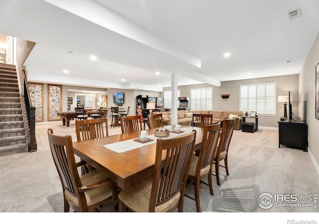 dining room with recessed lighting, light colored carpet, stairway, and baseboards