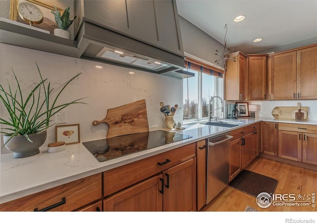 kitchen with brown cabinets, stainless steel dishwasher, black electric cooktop, and a sink