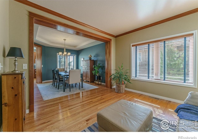 dining space with visible vents, plenty of natural light, and light wood finished floors