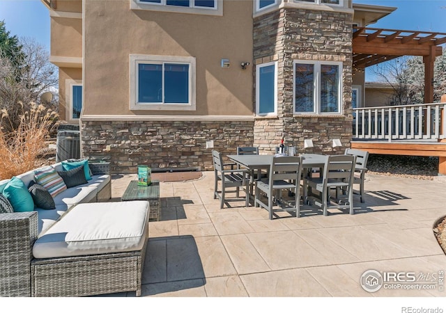 view of patio featuring outdoor lounge area, a pergola, and outdoor dining space