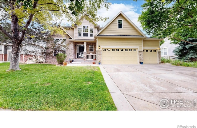 view of front of home with a garage, concrete driveway, stone siding, covered porch, and a front lawn