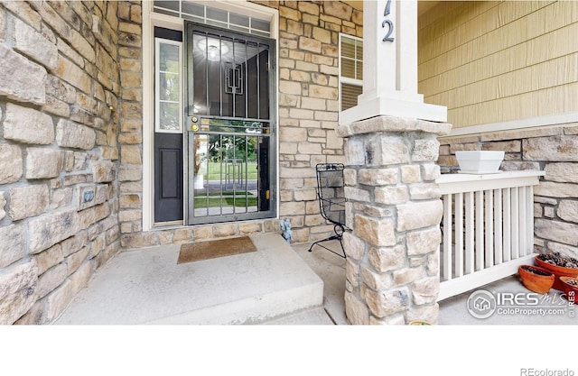 view of exterior entry with stone siding