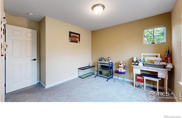 rec room featuring carpet and baseboards