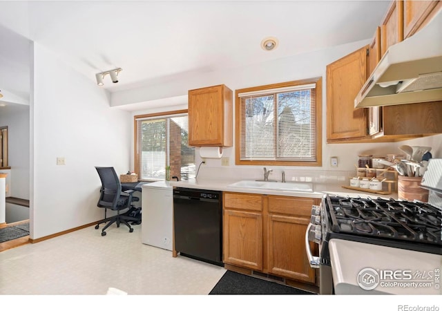 kitchen with light countertops, a sink, dishwasher, under cabinet range hood, and stainless steel gas range oven