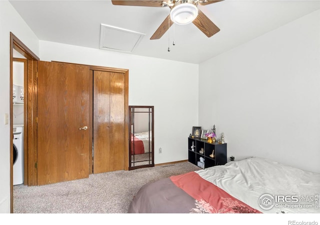 bedroom featuring attic access, washer / clothes dryer, ceiling fan, and light colored carpet