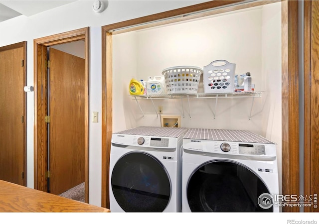 laundry room featuring washer and clothes dryer