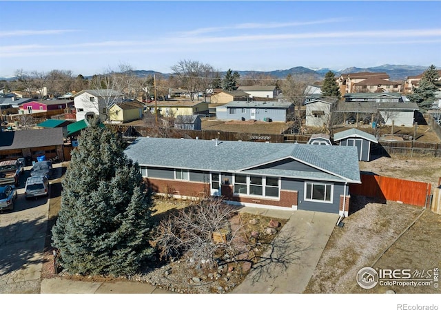 birds eye view of property featuring a residential view and a mountain view