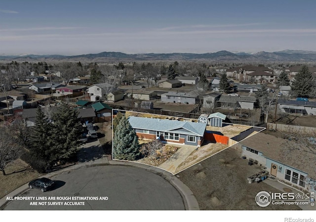 birds eye view of property with a residential view and a mountain view