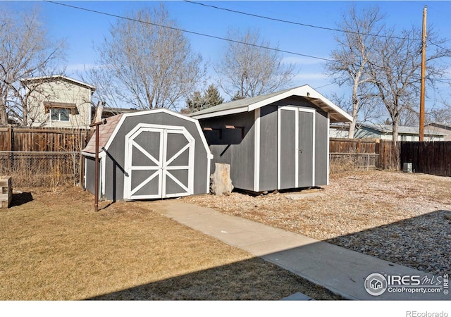 view of shed with a fenced backyard