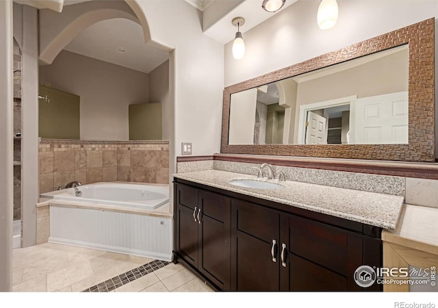 full bathroom with tile patterned flooring, vanity, and a bath