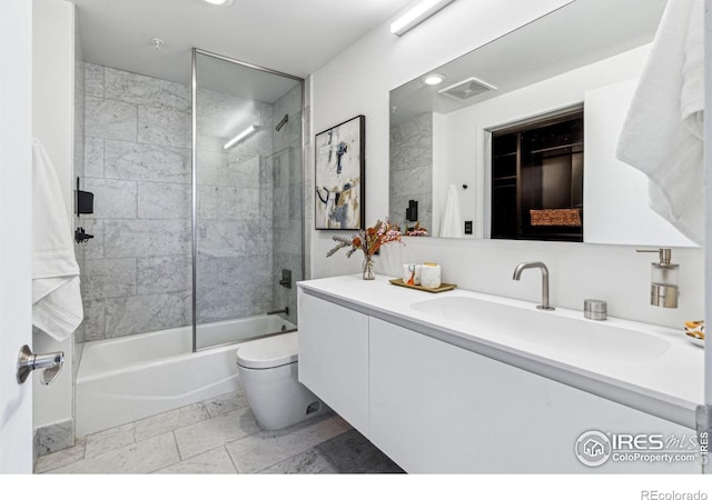 full bathroom featuring visible vents, shower / washtub combination, toilet, and vanity