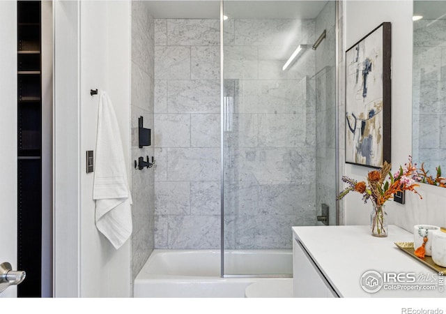 full bath featuring shower / bath combination with glass door and vanity