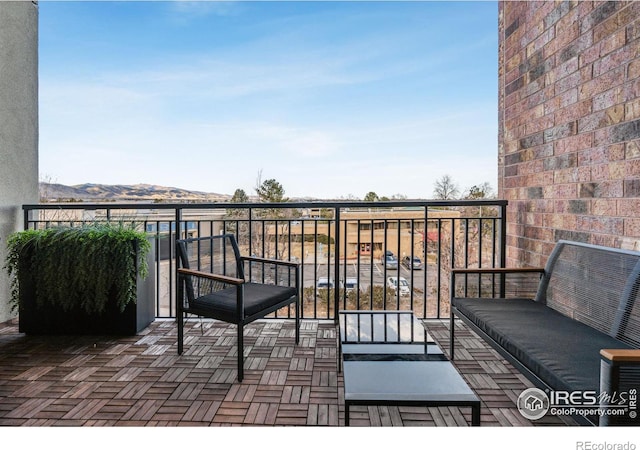 balcony with a mountain view and outdoor lounge area