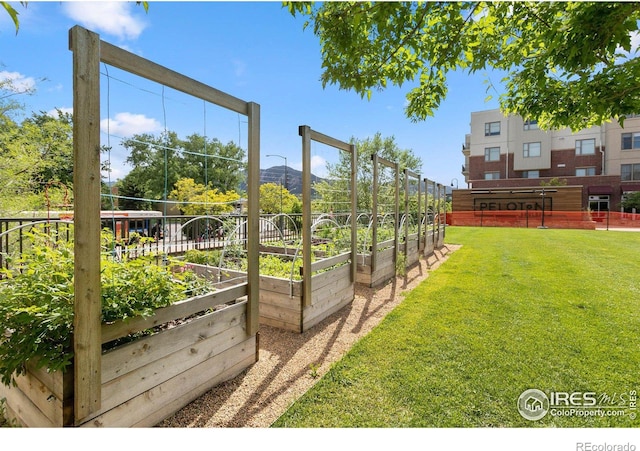 view of yard with a vegetable garden and a mountain view