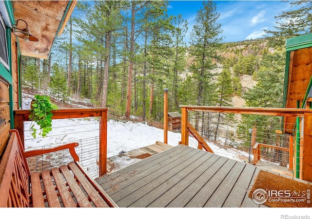 view of snow covered deck