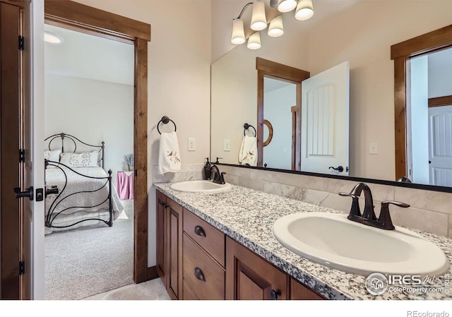 full bathroom featuring double vanity and a sink